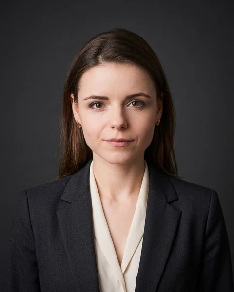 Example AI profile photo: Charcoal · suit & blouse, women’s cut