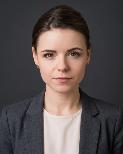 Example AI profile photo: Charcoal · suit, women’s cut