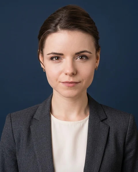 Professional headshot made with AI from the selfie: Navy · suit & blouse, women’s cut