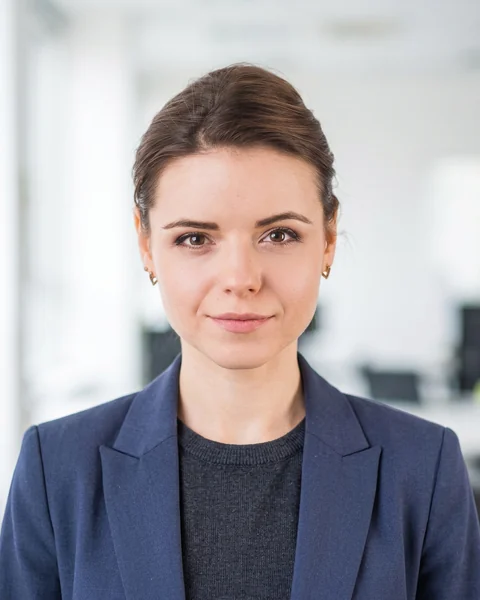 Professional headshot made with AI from the selfie: Bright office · smart casual, women’s cut