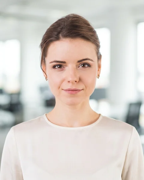Example AI profile photo: Bright office · shirt / blouse, women’s cut