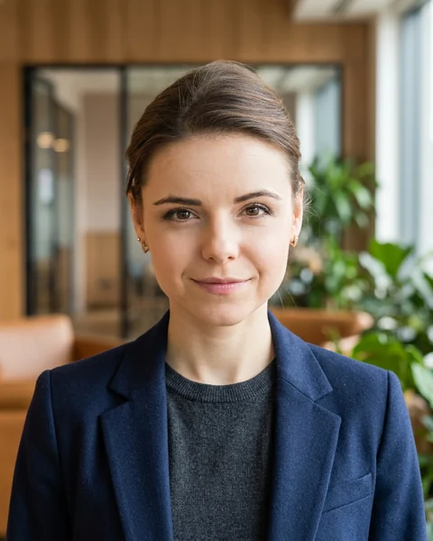 Example AI profile photo: Warm office · smart casual, women’s cut